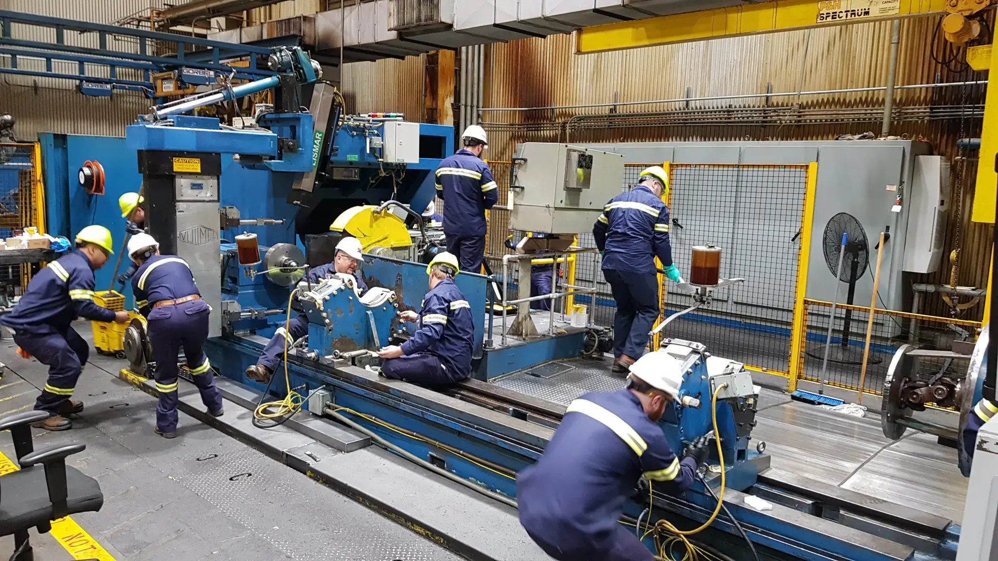 Autonomous Maintenance workshop team restoring industrial equipment